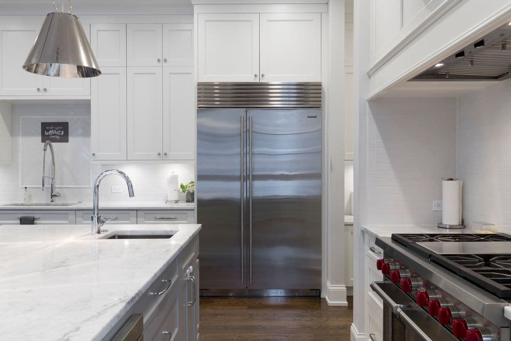 Kitchen refrigerator area prepared for interior appliance cleaning